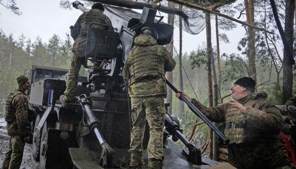 Ukrainian servicemen fires a self-propelled howitzer "Bohdana" towards Russian positions near Bakhmut, Ukraine, Donetsk region, Ukraine, Friday, Jan. 26, 2024. (AP Photo/Efrem Lukatsky)